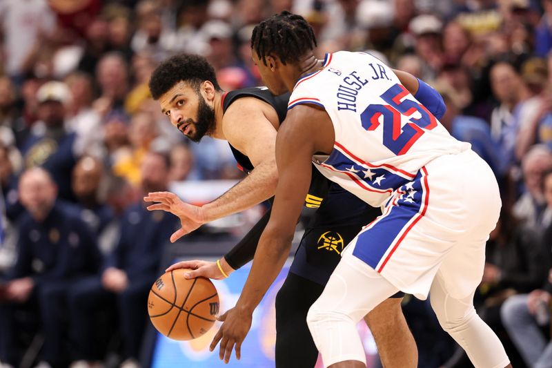 DENVER, COLORADO - JANUARY 27: Jamal Murray #27 of the Denver Nuggets guards the ball from Danuel House Jr. #25 of the Philadelphia 76ers during the second half of the game between the Denver Nuggets and the Philadelphia 76ers at Ball Arena on January 27, 2024 in Denver, Colorado. NOTE TO USER: User expressly acknowledges and agrees that, by downloading and or using this photograph, User is consenting to the terms and conditions of the Getty Images License Agreement. (Photo by Brendall O'Banon/Clarkson Creative/Getty Images)