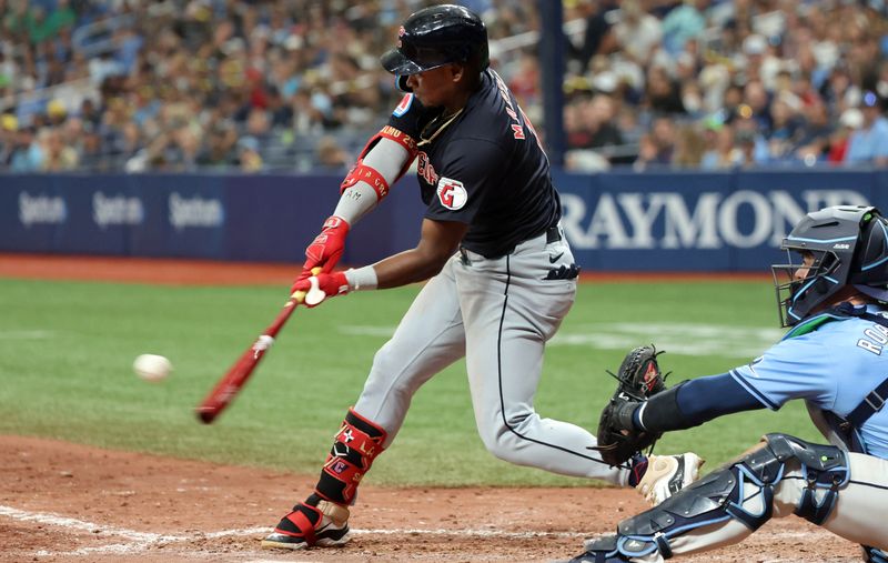 Jul 14, 2024; St. Petersburg, Florida, USA;  Cleveland Guardians third base Angel Martinez (1) singles during the ninth inning against the Tampa Bay Rays at Tropicana Field. Mandatory Credit: Kim Klement Neitzel-USA TODAY Sports