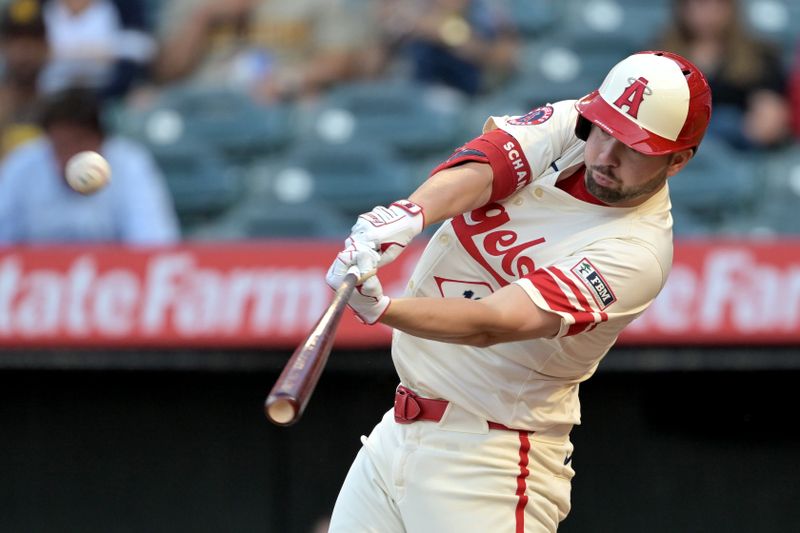 Jun 5, 2024; Anaheim, California, USA;  Los Angeles Angels first baseman Nolan Schanuel (18) hits a lead off solo home run in the first inning against the San Diego Padres at Angel Stadium. Mandatory Credit: Jayne Kamin-Oncea-USA TODAY Sports