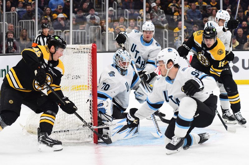 Nov 21, 2024; Boston, Massachusetts, USA;  Utah Hockey Club defenseman Mikhail Sergachev (98) blocks the pass of Boston Bruins left wing Cole Koepke (45) during the third period at TD Garden. Mandatory Credit: Bob DeChiara-Imagn Images