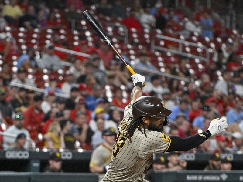 Aug 28, 2023; St. Louis, Missouri, USA;  San Diego Padres right fielder Fernando Tatis Jr. (23) hits a single against the St. Louis Cardinals during the ninth inning at Busch Stadium. Mandatory Credit: Jeff Curry-USA TODAY Sports