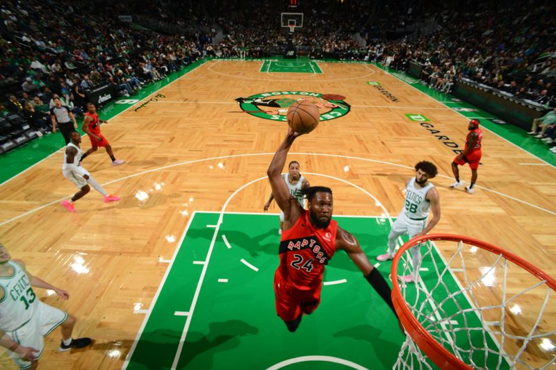 BOSTON, MA - OCTOBER 13: Bruno Fernando #24 of the Toronto Raptors dunks the ball during the game against the Boston Celtics during a NBA pre season game on October 13, 2024 at TD Garden in Boston, Massachusetts. NOTE TO USER: User expressly acknowledges and agrees that, by downloading and/or using this Photograph, user is consenting to the terms and conditions of the Getty Images License Agreement. Mandatory Copyright Notice: Copyright 2024 NBAE (Photo by Brian Babineau/NBAE via Getty Images)