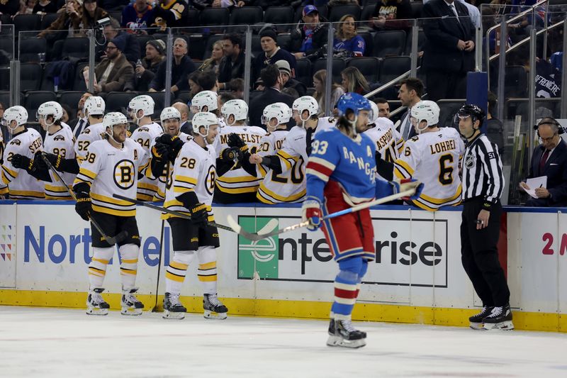 Jan 26, 2026; New York, New York, USA; Boston Bruins center Elias Lindholm (28) celebrates his goal against the New York Rangers with teammates during the second period at Madison Square Garden. Mandatory Credit: Brad Penner-Imagn Images