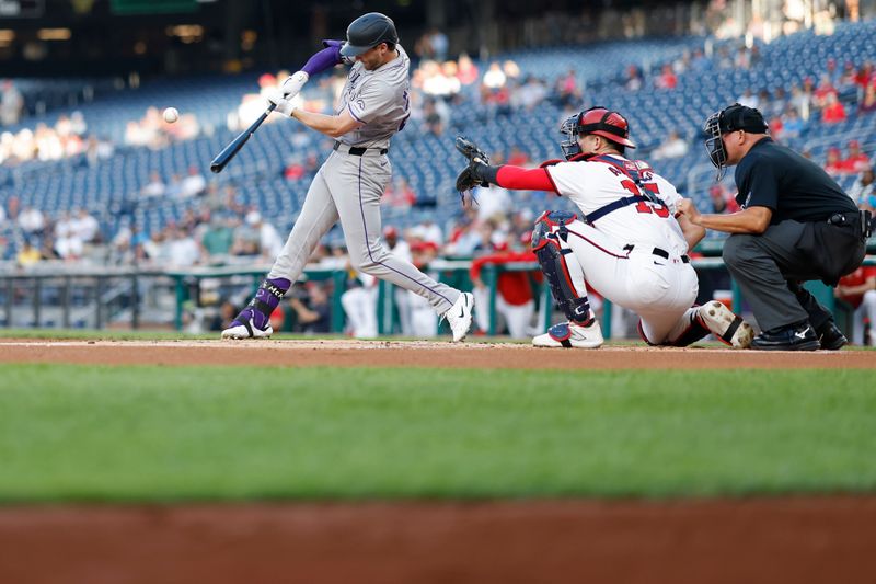 Aug 20, 2024; Washington, District of Columbia, USA; Colorado Rockies third baseman Ryan McMahon (24) hits an RBI single against the Washington Nationals during the first inning at Nationals Park. Mandatory Credit: Geoff Burke-USA TODAY Sports