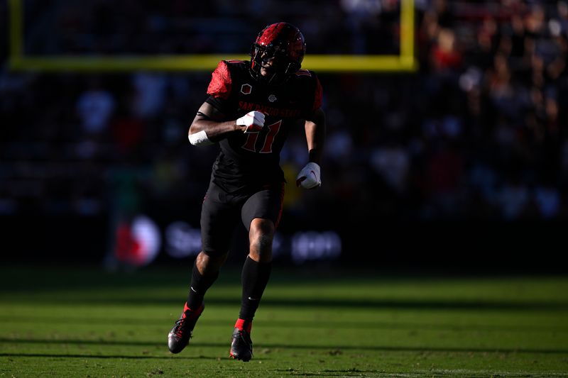 Aug 26, 2023; San Diego, California, USA; San Diego State Aztecs wide receiver Brionne Penny (11) runs during the first half against the Ohio Bobcats at Snapdragon Stadium. Mandatory Credit: Orlando Ramirez-USA TODAY Sports