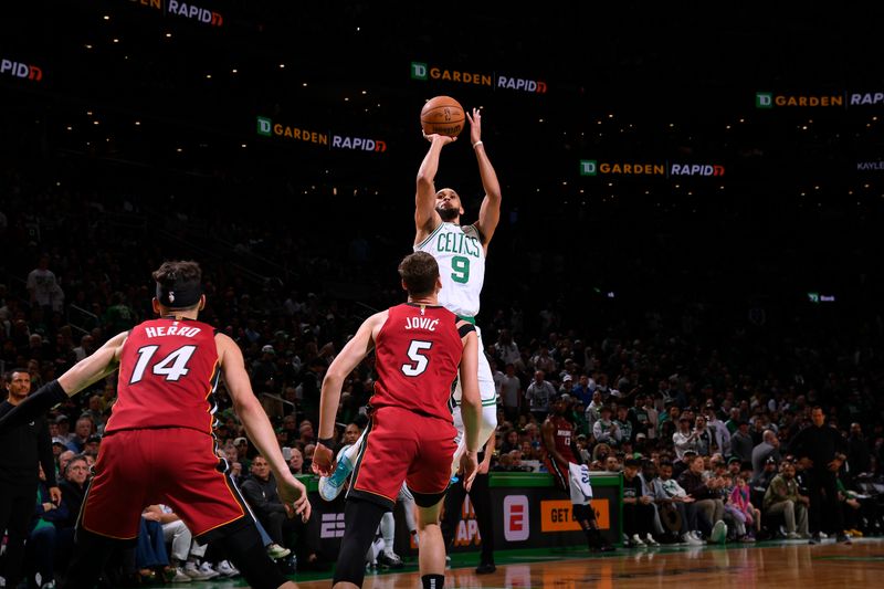 BOSTON, MA - APRIL 21: Derrick White #9 of the Boston Celtics shoots a three point basket against the Miami Heat during Round 1 Game 1 of the 2024 NBA Playoffs on April 21, 2024 at the TD Garden in Boston, Massachusetts. NOTE TO USER: User expressly acknowledges and agrees that, by downloading and or using this photograph, User is consenting to the terms and conditions of the Getty Images License Agreement. Mandatory Copyright Notice: Copyright 2024 NBAE  (Photo by Brian Babineau/NBAE via Getty Images)