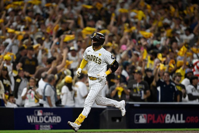 Oct 1, 2024; San Diego, California, USA; San Diego Padres catcher Kyle Higashioka (20) runs the bases after hitting a solo home run against the Atlanta Braves during the eighth inning in game one of the Wildcard round for the 2024 MLB Playoffs at Petco Park. Mandatory Credit: Denis Poroy-Imagn Images