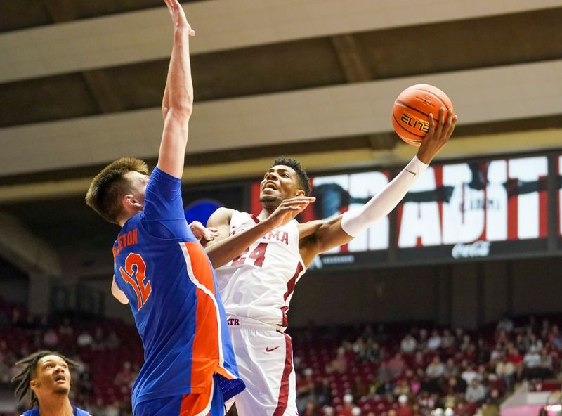 Feb 8, 2023; Tuscaloosa, Alabama, USA; Alabama Crimson Tide forward Brandon Miller (24) shoots against Florida Gators forward Colin Castleton (12) during the second half at Coleman Coliseum. Mandatory Credit: Marvin Gentry-USA TODAY Sports