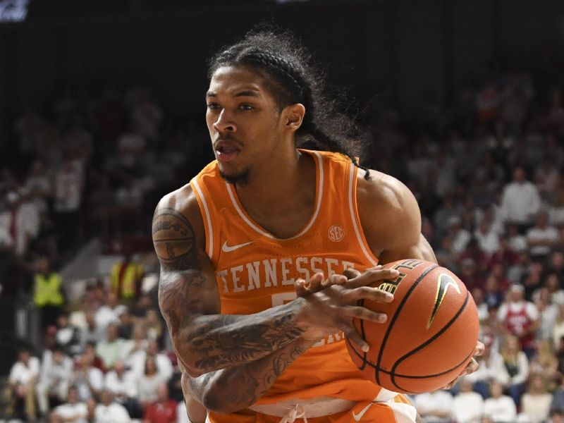 Mar 2, 2024; Tuscaloosa, Alabama, USA;  Tennessee guard Zakai Zeigler (5) grabs a rebound against Alabama at Coleman Coliseum. Mandatory Credit: Gary Cosby Jr.-USA TODAY Sports