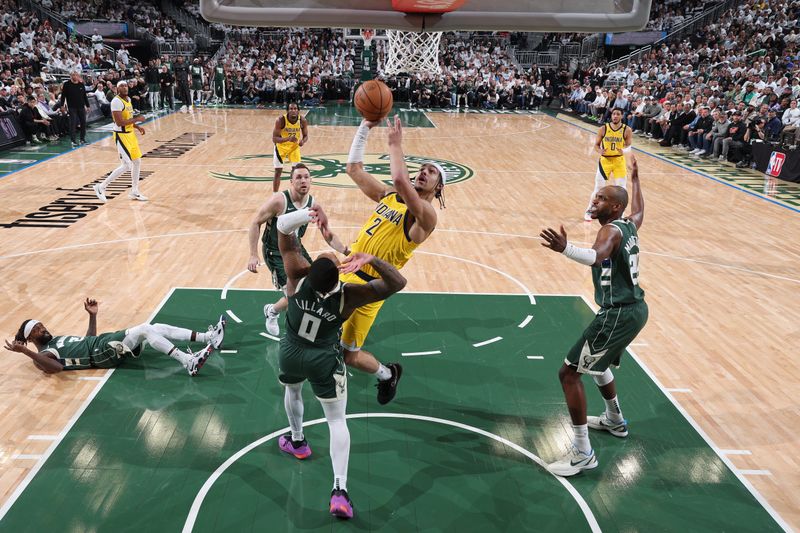 MILWAUKEE, WI - APRIL 23: Andrew Nembhard #2 of the Indiana Pacers drives to the basket during Round 1 Game 2 of the 2024 NBA Playoffs against the Milwaukee Bucks on April 23, 2024 at the Fiserv Forum Center in Milwaukee, Wisconsin. NOTE TO USER: User expressly acknowledges and agrees that, by downloading and or using this Photograph, user is consenting to the terms and conditions of the Getty Images License Agreement. Mandatory Copyright Notice: Copyright 2024 NBAE (Photo by Jeff Haynes/NBAE via Getty Images).