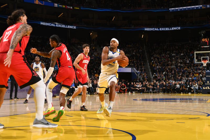 SAN FRANCISCO, CA - DECEMBER 5: Moses Moody #4 of the Golden State Warriors drives to the basket during the game against the Houston Rockets on December 5, 2024 at Chase Center in San Francisco, California. NOTE TO USER: User expressly acknowledges and agrees that, by downloading and or using this photograph, user is consenting to the terms and conditions of Getty Images License Agreement. Mandatory Copyright Notice: Copyright 2024 NBAE (Photo by Noah Graham/NBAE via Getty Images)