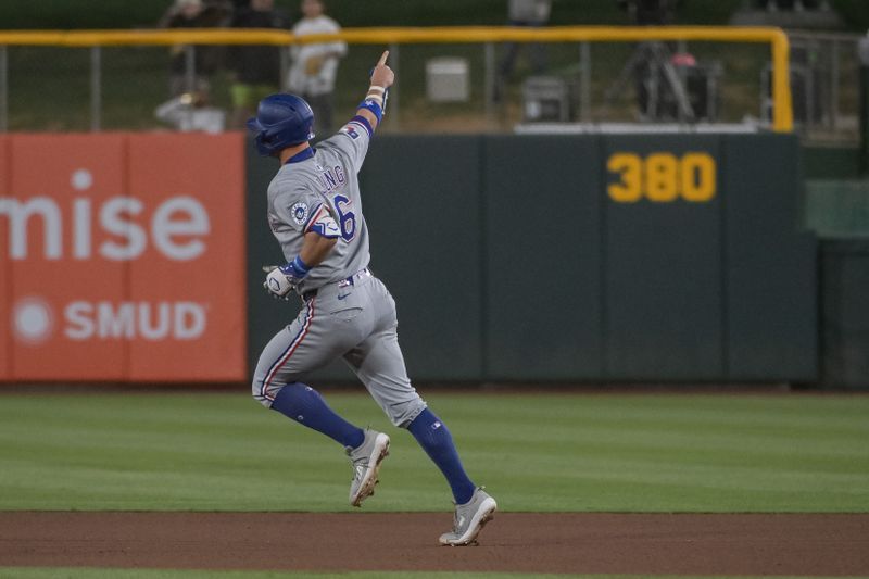 Apr 24, 2025; West Sacramento, California, USA; Texas Rangers third baseman Josh Jung (6) rounds the bases after hitting a home run against the Athletics during the fourth inning at Sutter Health Park. Mandatory Credit: Ed Szczepanski-Imagn Images