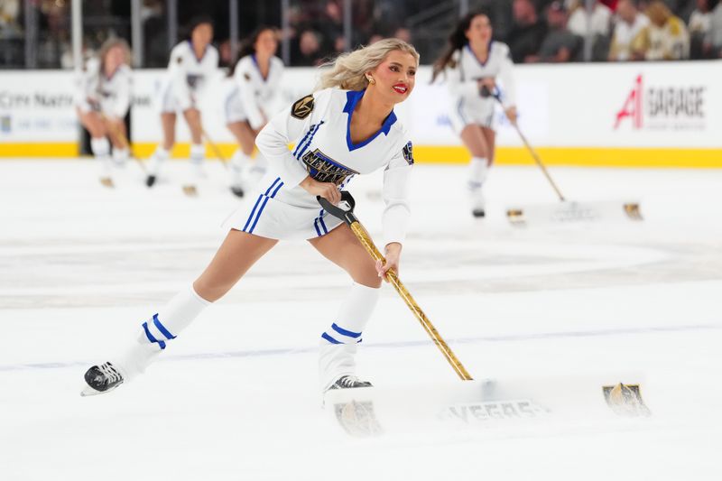 Oct 25, 2024; Las Vegas, Nevada, USA; A member of the Knights Guard ice crew skates during a game between the Vegas Golden Knights and the Ottawa Senators during the first period at T-Mobile Arena. Mandatory Credit: Stephen R. Sylvanie-Imagn Images