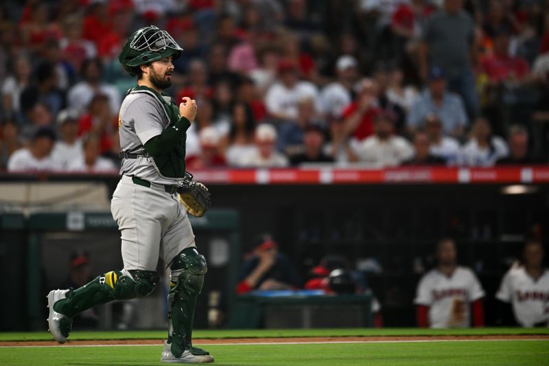 Jul 27, 2024; Anaheim, California, USA; Oakland Athletics catcher Shea Langeliers (23) walks to the mound against the Los Angeles Angels during the sixth inning at Angel Stadium. Mandatory Credit: Jonathan Hui-USA TODAY Sports