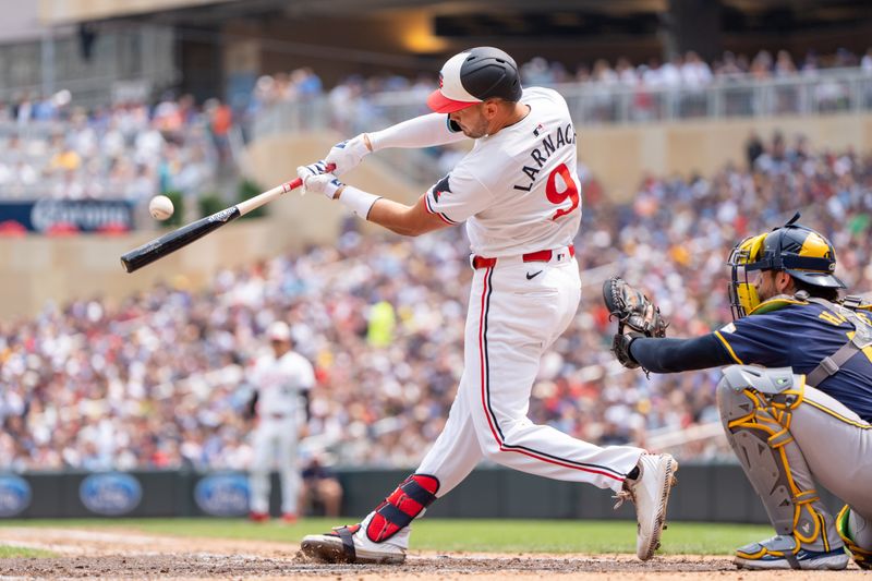 Jul 21, 2024; Minneapolis, Minnesota, USA; Minnesota Twins designated hitter Trevor Larnach (9) hits a home run in the fifth inning against the Milwaukee Brewers at Target Field. Mandatory Credit: Matt Blewett-USA TODAY Sports