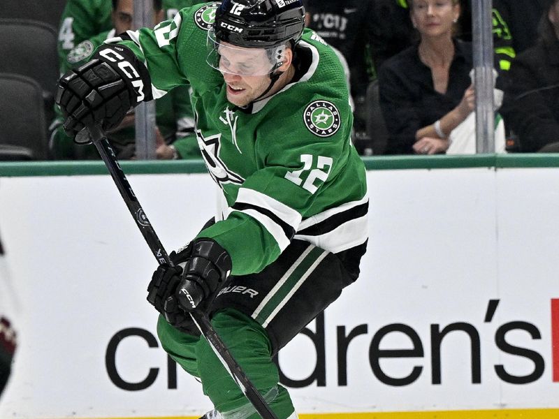 Nov 14, 2023; Dallas, Texas, USA; Dallas Stars center Radek Faksa (12) shoots the puck in the Arizona Coyotes zone during the second period at the American Airlines Center. Mandatory Credit: Jerome Miron-USA TODAY Sports