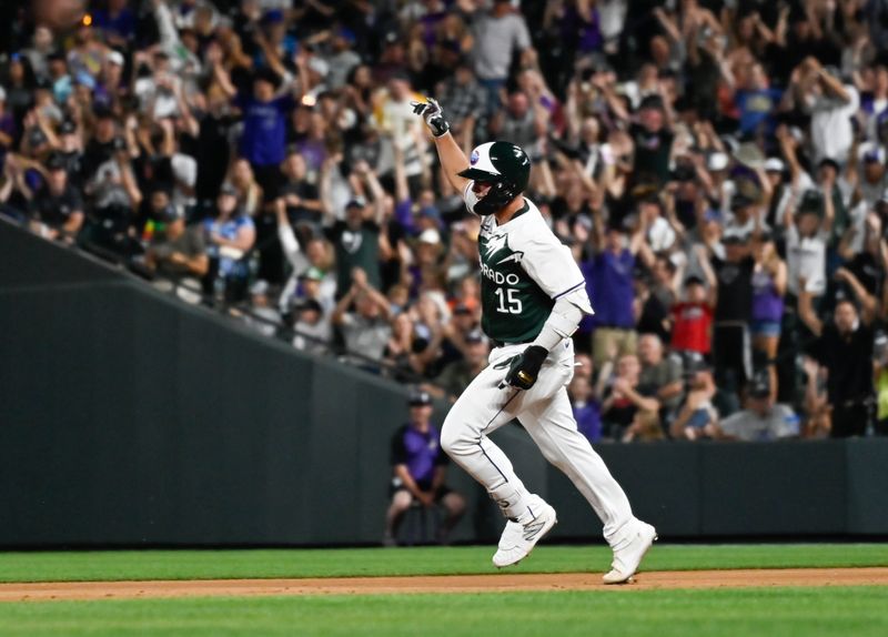 Jun 15, 2024; Denver, Colorado, USA;  Colorado Rockies catcher Hunter Goodman (15) rounds the bases after hitting his second home run of the game in the seventh inning against the Pittsburgh Pirates at Coors Field. Mandatory Credit: John Leyba-USA TODAY Sports