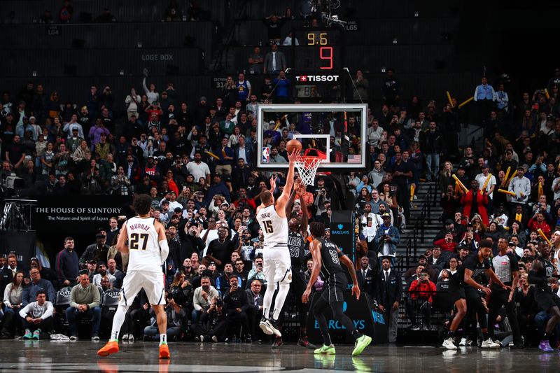 BROOKLYN, NY - OCTOBER 29: Nikola Jokic #15 of the Denver Nuggets makes the game winning shot during the game against the Brooklyn Nets on October 29, 2024 at Barclays Center in Brooklyn, New York. NOTE TO USER: User expressly acknowledges and agrees that, by downloading and or using this Photograph, user is consenting to the terms and conditions of the Getty Images License Agreement. Mandatory Copyright Notice: Copyright 2024 NBAE (Photo by David L. Nemec/NBAE via Getty Images)