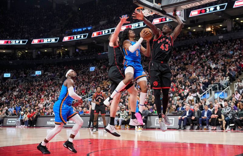 TORONTO, ON - MARCH 16: Jalen Williams #8 of the Oklahoma City Thunder goes to the basket against Pascal Siakam #43 of the Toronto Raptors during the first half of their basketball game at the Scotiabank Arena on March 16, 2023 in Toronto, Ontario, Canada. NOTE TO USER: User expressly acknowledges and agrees that, by downloading and/or using this Photograph, user is consenting to the terms and conditions of the Getty Images License Agreement. (Photo by Mark Blinch/Getty Images)