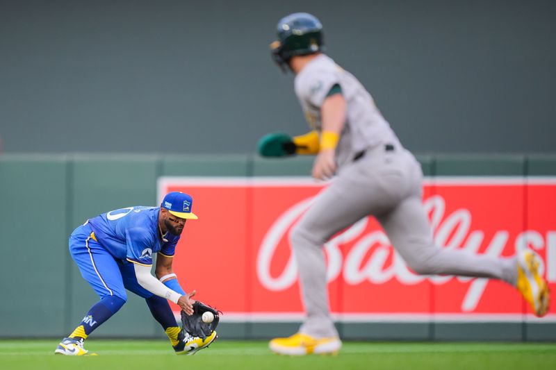 Jun 14, 2024; Minneapolis, Minnesota, USA; Minnesota Twins second base Willi Castro (50) fields a ground ball against the Oakland Athletics in the first inning at Target Field. Mandatory Credit: Brad Rempel-USA TODAY Sports