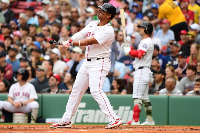 May 18, 2025; Boston, Massachusetts, USA;  Boston Red Sox designated hitter Rafael Devers (11) hits a grand slam during the third inning against the Atlanta Braves at Fenway Park. Mandatory Credit: Bob DeChiara-Imagn Images
