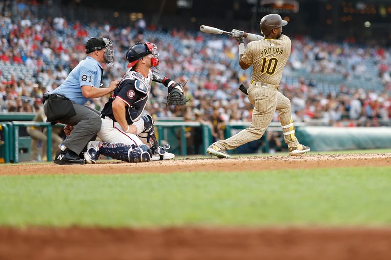 Jul 24, 2024; Washington, District of Columbia, USA; San Diego Padres outfielder Jurickson Profar (10) hits a two run home run against the Washington Nationals during the second inning at Nationals Park. Mandatory Credit: Geoff Burke-USA TODAY Sports