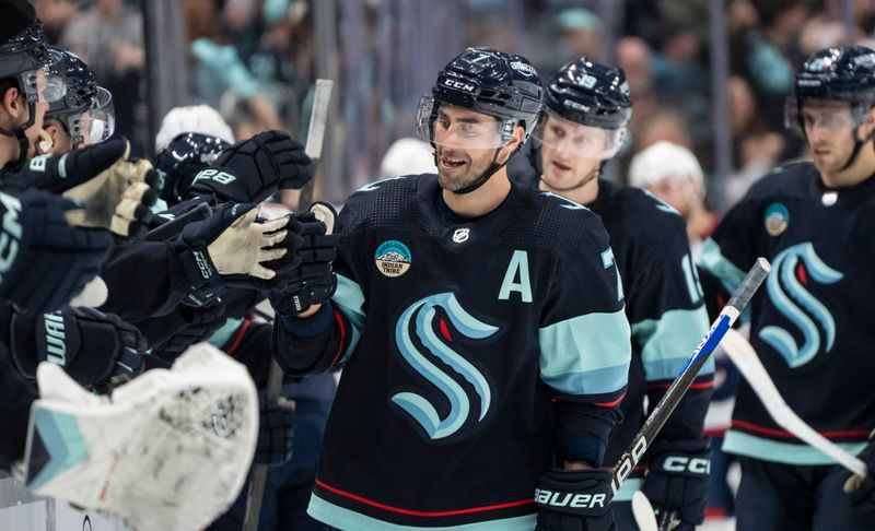 Jan 28, 2024; Seattle, Washington, USA; Seattle Kraken forward Jordan Eberle (7) celebrates with team as on the bench after scoring a goal against the Columbus Blue Jackets during the first period at Climate Pledge Arena. Mandatory Credit: Stephen Brashear-USA TODAY Sports