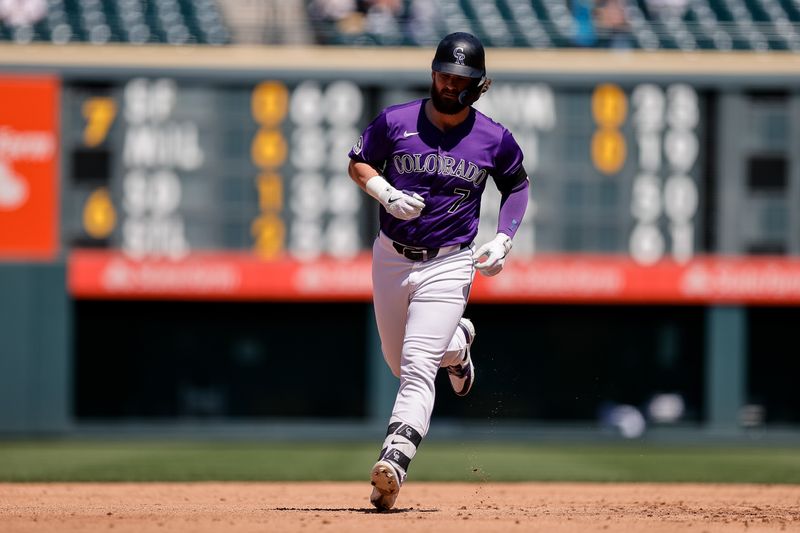 Aug 29, 2024; Denver, Colorado, USA; Colorado Rockies second baseman Brendan Rodgers (7) rounds the bases on a solo home run in the third inning against the Miami Marlins at Coors Field. Mandatory Credit: Isaiah J. Downing-USA TODAY Sports