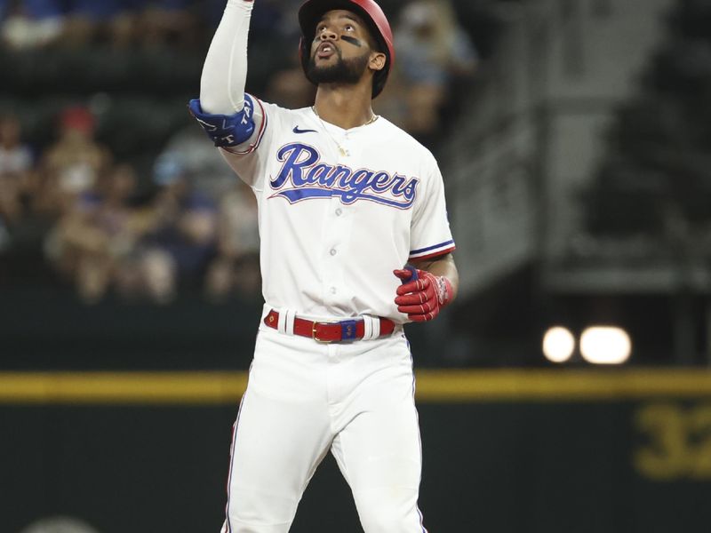 Jun 28, 2023; Arlington, Texas, USA;  Texas Rangers center fielder Leody Taveras (3) reacts after hitting a double during the seventh inning against the Detroit Tigers at Globe Life Field. Mandatory Credit: Kevin Jairaj-USA TODAY Sports