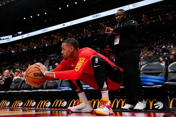 TORONTO, ON - DECEMBER 13: Dejounte Murray #5 of the Atlanta Hawks stretches before facing tech Toronto Raptors at Scotiabank Arena on December 13, 2023 in Toronto, Ontario, Canada. NOTE TO USER: User expressly acknowledges and agrees that, by downloading and/or using this Photograph, user is consenting to the terms and conditions of the Getty Images License Agreement. (Photo by Andrew Lahodynskyj/Getty Images)