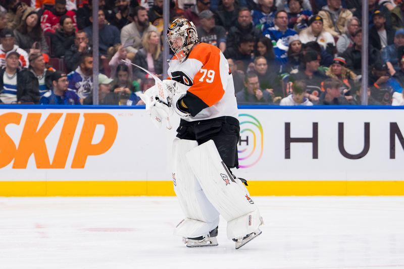 Dec 28, 2023; Vancouver, British Columbia, CAN; Philadelphia Flyers goalie Carter Hart (79) skates on the ice after replacing goalie Samuel Ersson (33) against the Vancouver Canucks in the third period at Rogers Arena. Flyers won 4-1. Mandatory Credit: Bob Frid-USA TODAY Sports