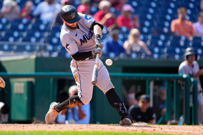 Sep 3, 2023; Washington, District of Columbia, USA;  Miami Marlins third baseman Jon Berti (5) hits a single against the Washington Nationals during the sixth inning at Nationals Park. Mandatory Credit: Gregory Fisher-USA TODAY Sports