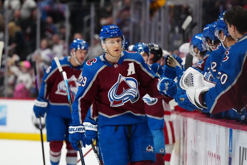 Mar 6, 2024; Denver, Colorado, USA; Colorado Avalanche center Nathan MacKinnon (29) celebrates his assist on goal in the first period against the Detroit Red Wings at Ball Arena. Mandatory Credit: Ron Chenoy-USA TODAY Sports