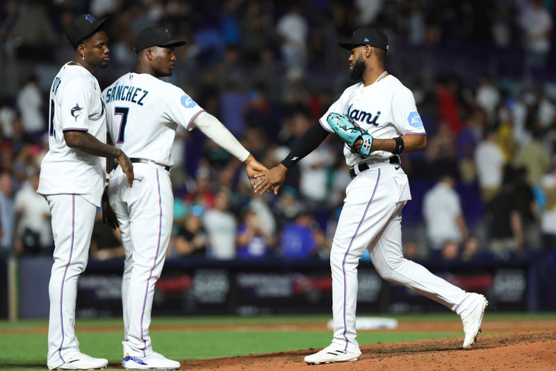 Sep 5, 2023; Miami, Florida, USA; Miami Marlins left fielder Bryan De La Cruz (14) celebrates with right fielder Jesus Sanchez (7) and designated hitter Jorge Soler (12) after winning the game against the Los Angeles Dodgers at loanDepot Park. Mandatory Credit: Sam Navarro-USA TODAY Sports