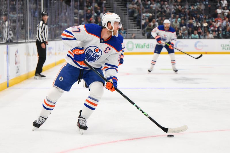 Oct 2, 2024; Seattle, Washington, USA; Edmonton Oilers center Connor McDavid (97) plays the puck during the second period against the Seattle Kraken at Climate Pledge Arena. Mandatory Credit: Steven Bisig-Imagn Images