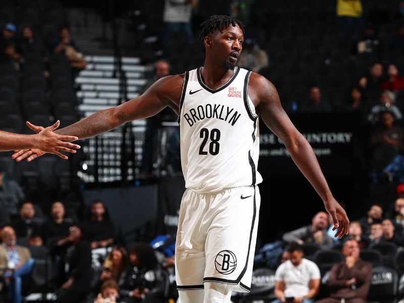 BROOKLYN, NY - OCTOBER 14: Dorian Finney-Smith #28 of the Brooklyn Nets high five during the game against the Washington Wizards during a NBA preseason game on October 14, 2024 at Barclays Center in Brooklyn, New York. NOTE TO USER: User expressly acknowledges and agrees that, by downloading and or using this Photograph, user is consenting to the terms and conditions of the Getty Images License Agreement. Mandatory Copyright Notice: Copyright 2024 NBAE (Photo by David L. Nemec/NBAE via Getty Images)