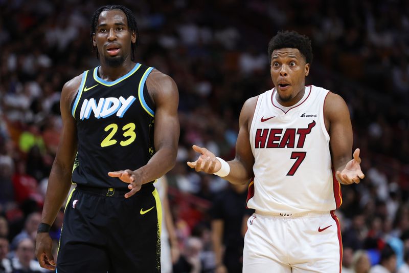 MIAMI, FLORIDA - DECEMBER 02: Aaron Nesmith #23 of the Indiana Pacers and Kyle Lowry #7 of the Miami Heat react during the second quarter of the game at Kaseya Center on December 02, 2023 in Miami, Florida. NOTE TO USER: User expressly acknowledges and agrees that, by downloading and or using this photograph, User is consenting to the terms and conditions of the Getty Images License Agreement. (Photo by Megan Briggs/Getty Images)