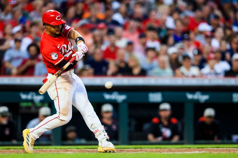 May 17, 2025; Cincinnati, Ohio, USA; Cincinnati Reds third baseman Santiago Espinal (4) hits a single in the eighth inning against the Cleveland Guardians at Great American Ball Park. Mandatory Credit: Katie Stratman-Imagn Images