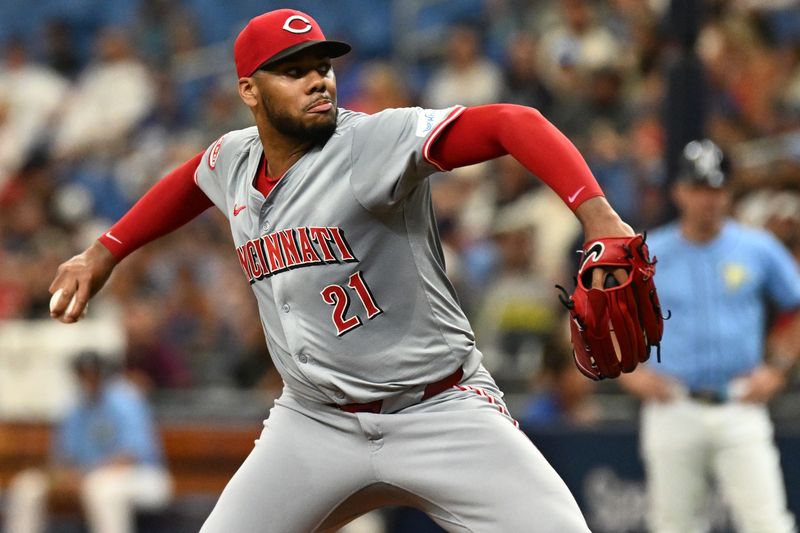 Jul 28, 2024; St. Petersburg, Florida, USA; Cincinnati Reds starting pitcher Hunter Greene (21) throws a pitch in the first inning against the Tampa Bay Rays at Tropicana Field. Mandatory Credit: Jonathan Dyer-USA TODAY Sports