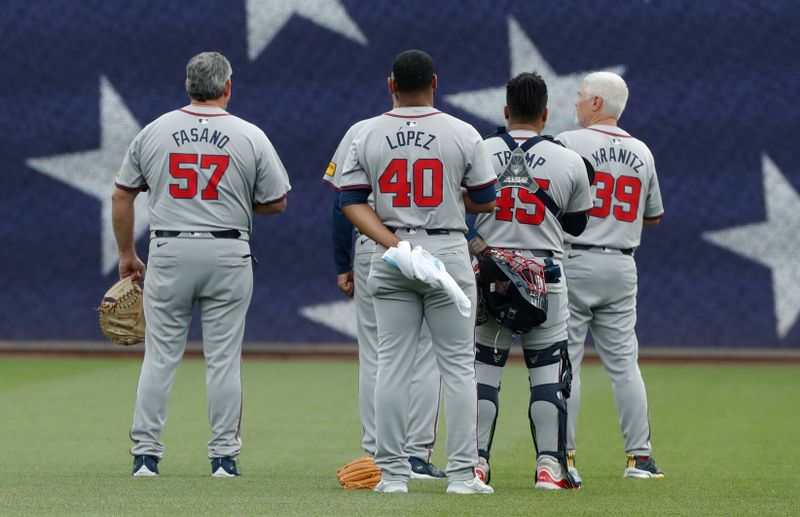 May 25, 2024; Pittsburgh, Pennsylvania, USA;  Atlanta Braves catching coach Sal Fasano (57) and starting pitcher Reynaldo López (40) and catcher Chadwick Tromp (45) and pitching coach Rick Kranitz (39) stand for the national anthem against the Pittsburgh Pirates at PNC Park. Mandatory Credit: Charles LeClaire-USA TODAY Sports