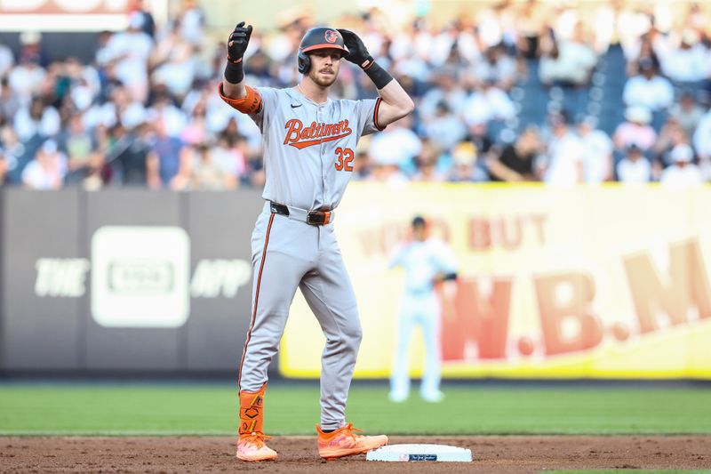 Jun 19, 2024; Bronx, New York, USA;  Baltimore Orioles designated hitter Ryan O'Hearn (32) celebrates after hitting an RBI double in the first inning against the New York Yankees at Yankee Stadium. Mandatory Credit: Wendell Cruz-USA TODAY Sports