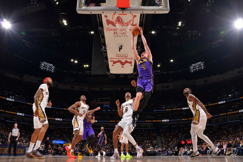 NEW ORLEANS, LA - NOVEMBER 16: Dalton Knecht #4 of the Los Angeles Lakers dunks the ball during the game against the New Orleans Pelicans on November 16, 2024 at the Smoothie King Center in New Orleans, Louisiana. NOTE TO USER: User expressly acknowledges and agrees that, by downloading and or using this Photograph, user is consenting to the terms and conditions of the Getty Images License Agreement. Mandatory Copyright Notice: Copyright 2024 NBAE (Photo by Jesse D. Garrabrant/NBAE via Getty Images)