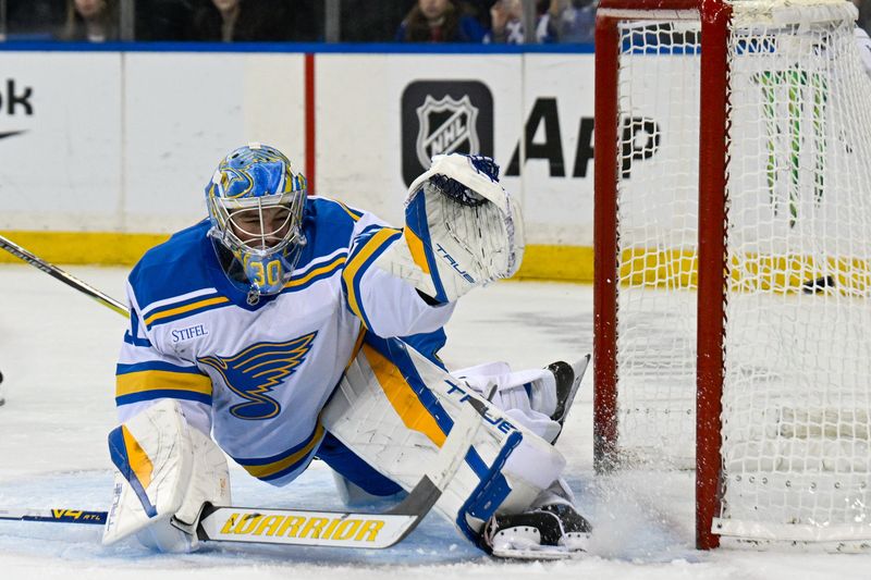 Nov 24, 2025; New York, New York, USA; New York Rangers center Vincent Trocheck (16) (not pictured) scores a goal past St. Louis Blues goaltender Joel Hofer (30) during the second period at Madison Square Garden. Mandatory Credit: Dennis Schneidler-Imagn Images