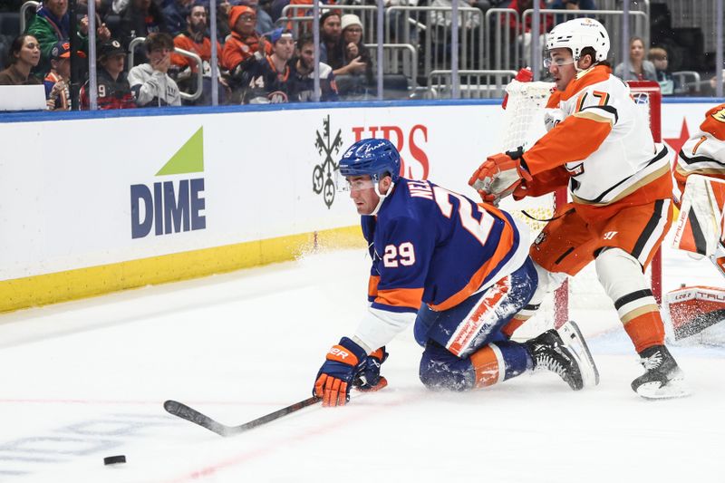 Oct 29, 2024; Elmont, New York, USA;  New York Islanders center Brock Nelson (29) and Anaheim Ducks left wing Alex Killorn (17) chase the puck in the second period at UBS Arena. Mandatory Credit: Wendell Cruz-Imagn Images