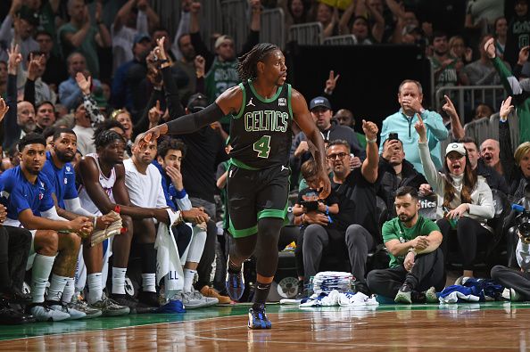 BOSTON, MA - DECEMBER 1: Jrue Holiday #4 of the Boston Celtics celebrates during the game against the Philadelphia 76ers on December 1, 2023 at the TD Garden in Boston, Massachusetts. NOTE TO USER: User expressly acknowledges and agrees that, by downloading and or using this photograph, User is consenting to the terms and conditions of the Getty Images License Agreement. Mandatory Copyright Notice: Copyright 2023 NBAE  (Photo by Brian Babineau/NBAE via Getty Images)