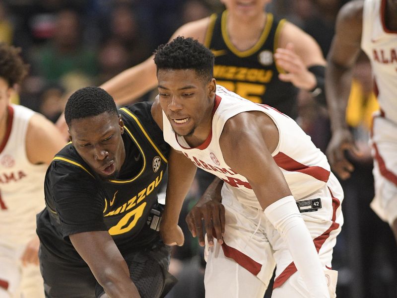 Mar 11, 2023; Nashville, TN, USA;  dMissouri Tigers forward Mohamed Diarra (0) and Alabama Crimson Tide forward Brandon Miller (24) fight for the loose ball during the second half at Bridgestone Arena. Mandatory Credit: Steve Roberts-USA TODAY Sports