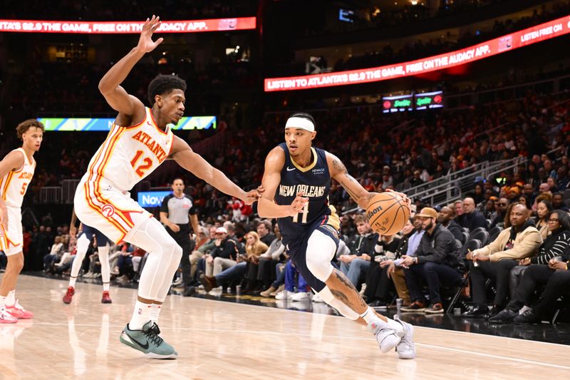 ATLANTA, GA - DECEMBER 2: Brandon Boston Jr. #11 of the New Orleans Pelicans handles the ball during the game against the Atlanta Hawks on December 2, 2024 at State Farm Arena in Atlanta, Georgia.  NOTE TO USER: User expressly acknowledges and agrees that, by downloading and/or using this Photograph, user is consenting to the terms and conditions of the Getty Images License Agreement. Mandatory Copyright Notice: Copyright 2024 NBAE (Photo by Adam Hagy/NBAE via Getty Images)