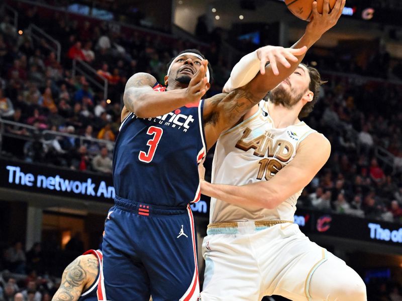 CLEVELAND, OHIO - MARCH 17: Cedi Osman #16 of the Cleveland Cavaliers fouls Bradley Beal #3 of the Washington Wizards during the fourth quarter of the game at Rocket Mortgage Fieldhouse on March 17, 2023 in Cleveland, Ohio. The Cavaliers defeated the Wizards 117-94. NOTE TO USER: User expressly acknowledges and agrees that, by downloading and or using this photograph, User is consenting to the terms and conditions of the Getty Images License Agreement. (Photo by Jason Miller/Getty Images)