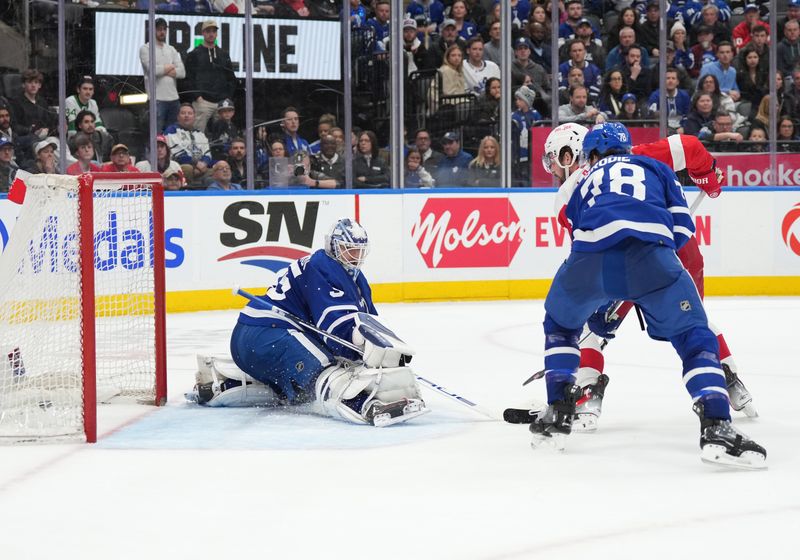 Apr 13, 2024; Toronto, Ontario, CAN; Detroit Red Wings center Dylan Larkin (71) score the winning goal against the Toronto Maple Leafs  during the overtime period at Scotiabank Arena. Mandatory Credit: Nick Turchiaro-USA TODAY Sports