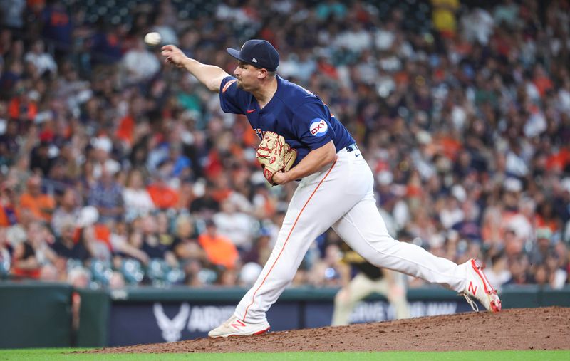 Sep 10, 2023; Houston, Texas, USA; Houston Astros relief pitcher Joel Kuhnel (60) pitches during the eighth inning against the San Diego Padres at Minute Maid Park. Mandatory Credit: Troy Taormina-USA TODAY Sports